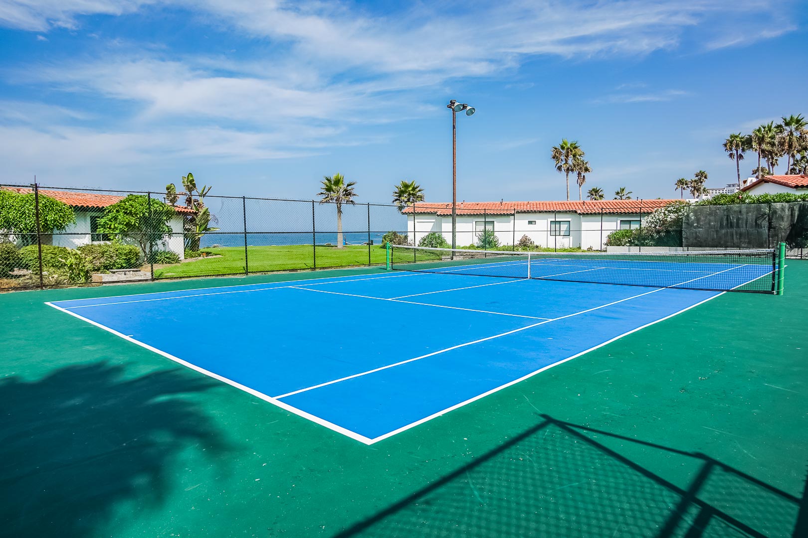 A vibrant tennis court by the beach A crisp outdoor swimming pool at VRI's La Paloma in Rosarito, Mexico.
